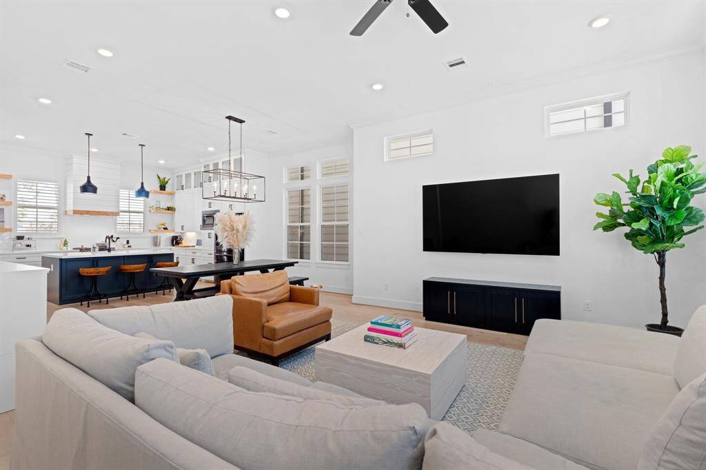 The open-concept living area seamlessly connects the living, dining, and kitchen spaces—ideal for both everyday living and entertaining.