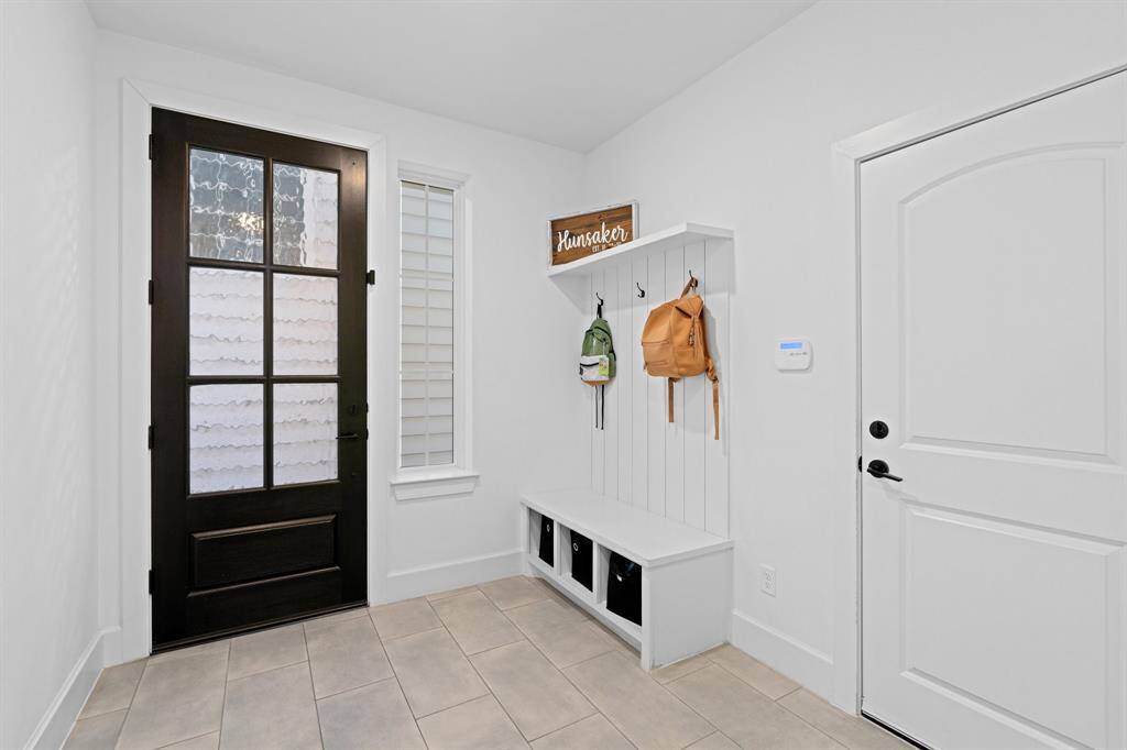 Back on the first floor, you will find a spacious entry with built in mudroom storage.