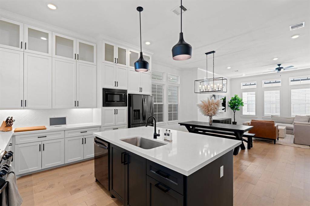 Plenty of kitchen storage space, complete with elegant display cabinets.
