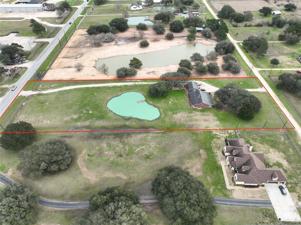 2920 Frontage on Left. Private road entrance on right . Businesses to the left in same neighborhood -Side view of boundaries