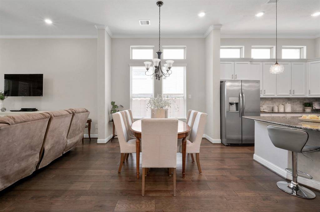 This open floor plan includes a Kitchen/Dining Combo. Notice all of the windows that let in a beautiful amount of sunlight into your home
