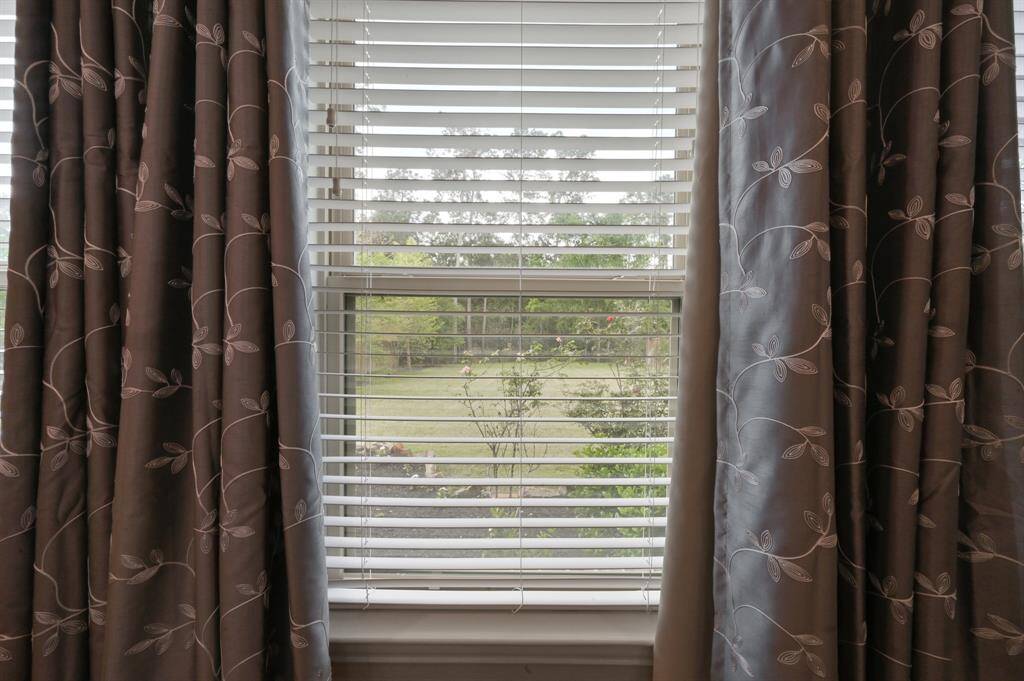 There are multiple windows in the Primary Bedroom looking out to your incredible yard & nature preserve.