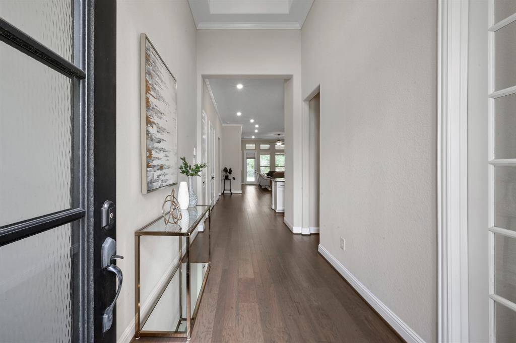 This One-Story home features HIGH CEILINGS & modern touches throughout