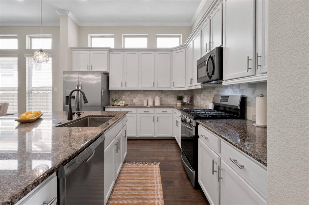 Your modern kitchen is perfect for entertaining with tons of storage & counter space. Notice your Farmhouse sink!