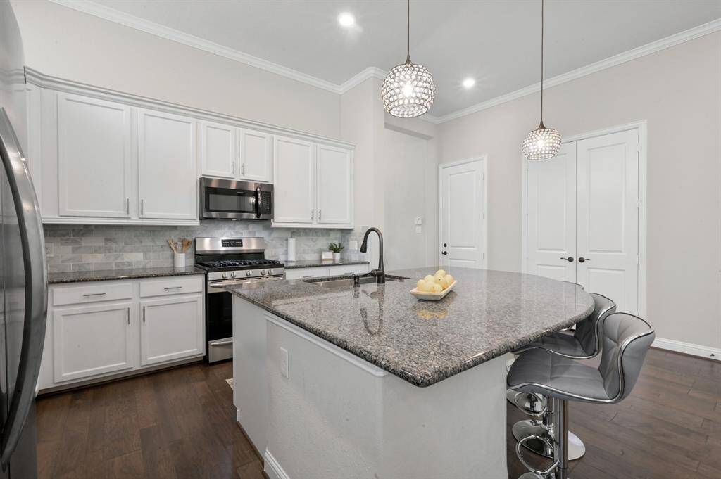 Check out the HUGE island/breakfast bar that is the perfect spot for gatherings. This kitchen is an entertainers dream