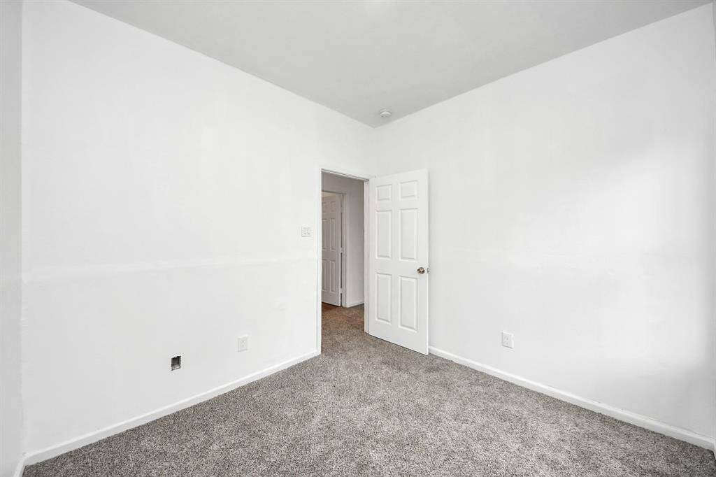 The master bedroom is spacious and thoughtfully designed, ample closet space, and large windows that fill the room with natural light.