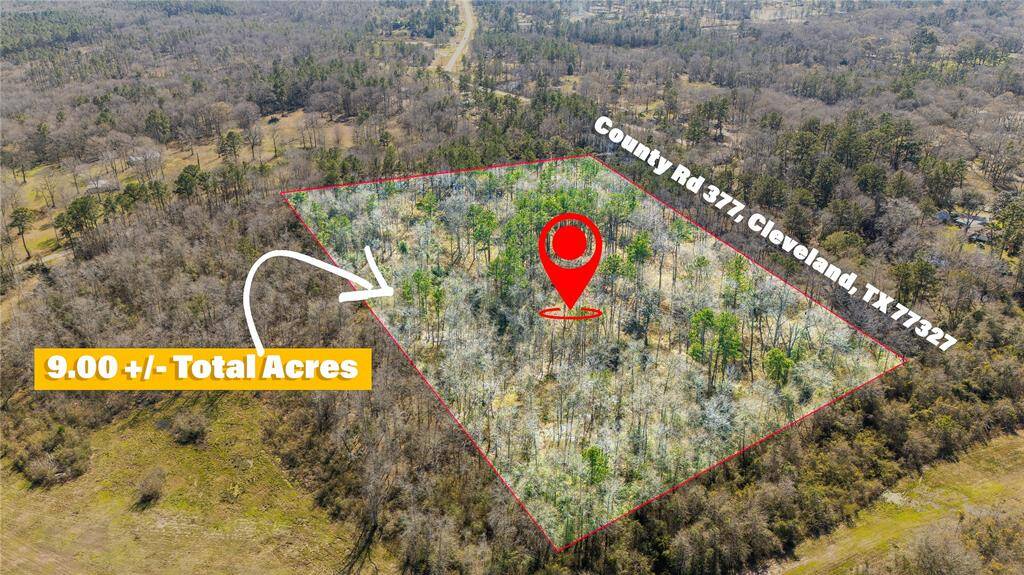 This aerial photo showcases a 9-acre wooded property located on County Rd 377 in Cleveland, TX 77327. The land is outlined, highlighting its expanse amidst a natural, forested setting. Ideal for those seeking privacy and space.