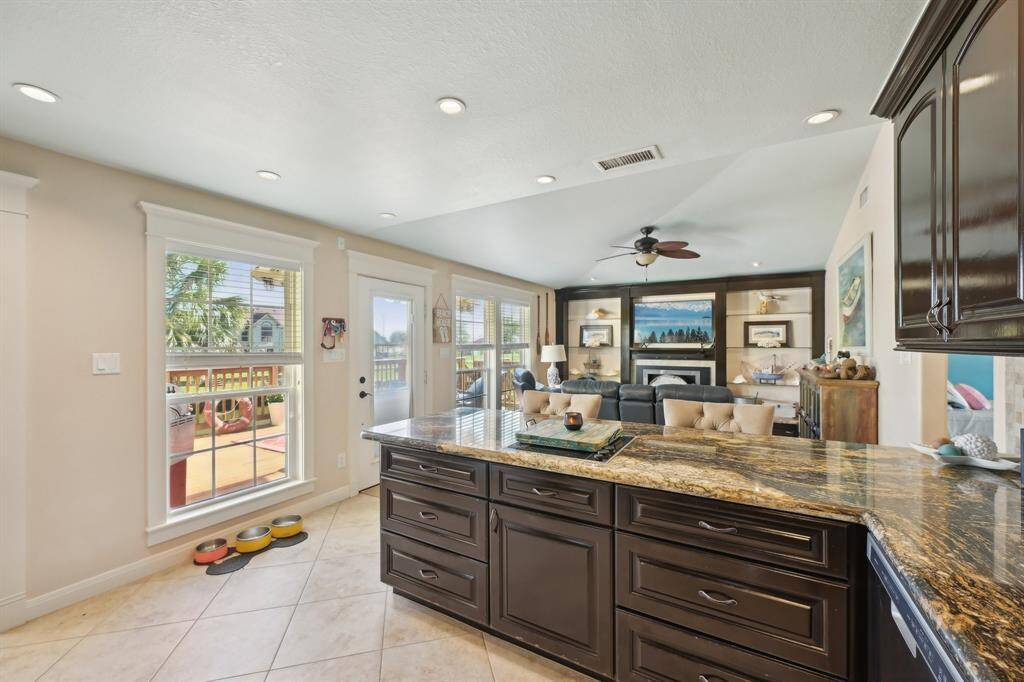 Kitchen open to living room with large bar