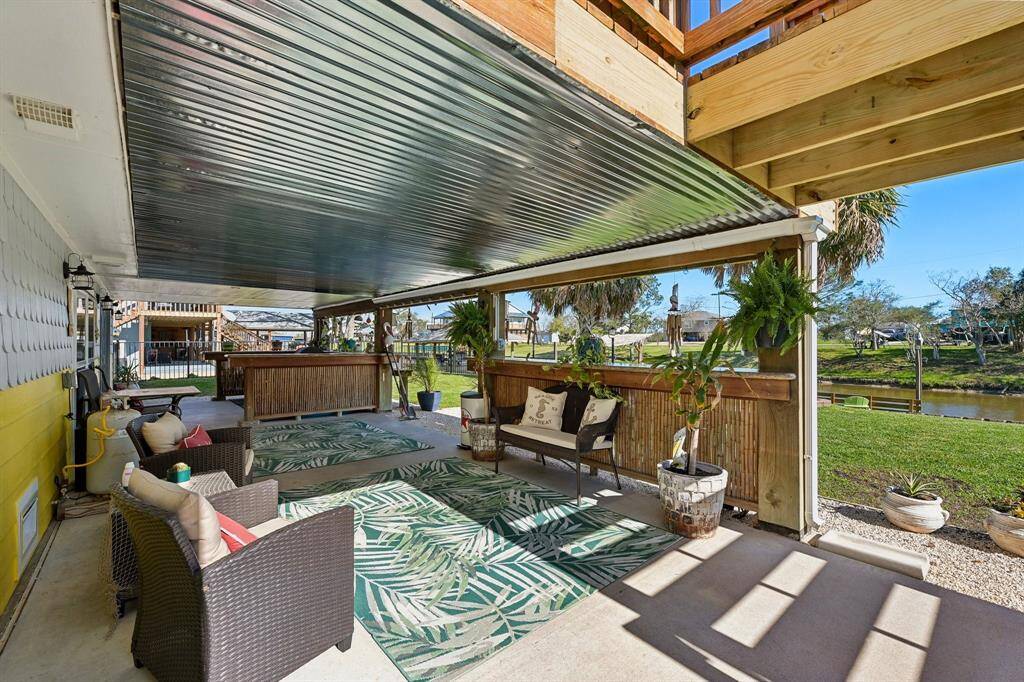 Downstairs covered back patio sitting area
