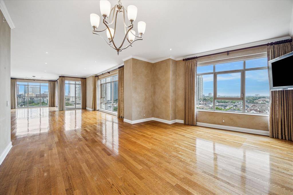 Enter this lovely condominium and you are met with natural sunlit rooms from floor to ceiling windows and an open floor plan!