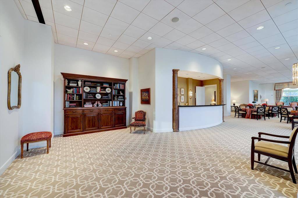 Recently redecorated, large party room with built-in cabinetry and a large, inviting bar.
