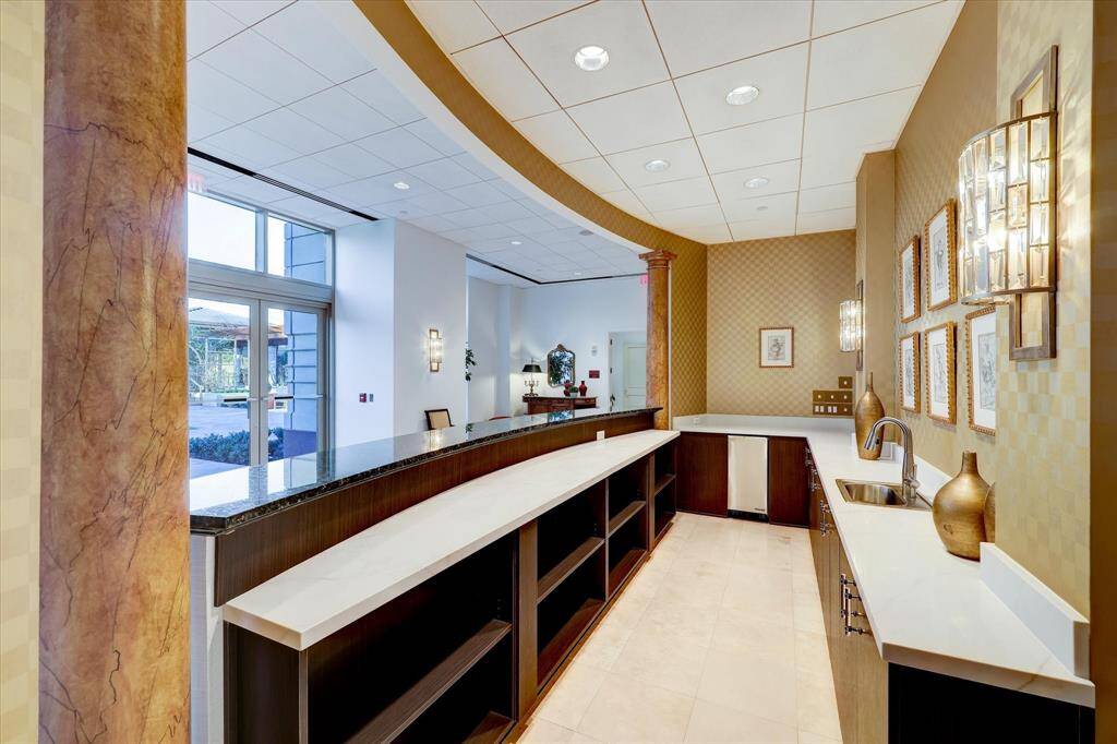 A look inside the bar with storage, an ice maker, granite counter tops perfect for serving buffet-type dinners!