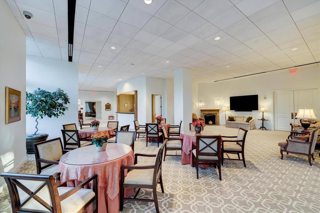 Dining tables in the party room with the large-screen TV within watching distance!