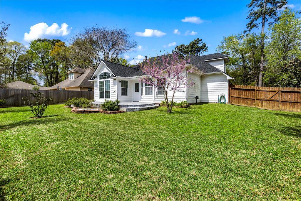Huge backyard with new concrete patio. Plenty of room for a pool or summer kitchen.