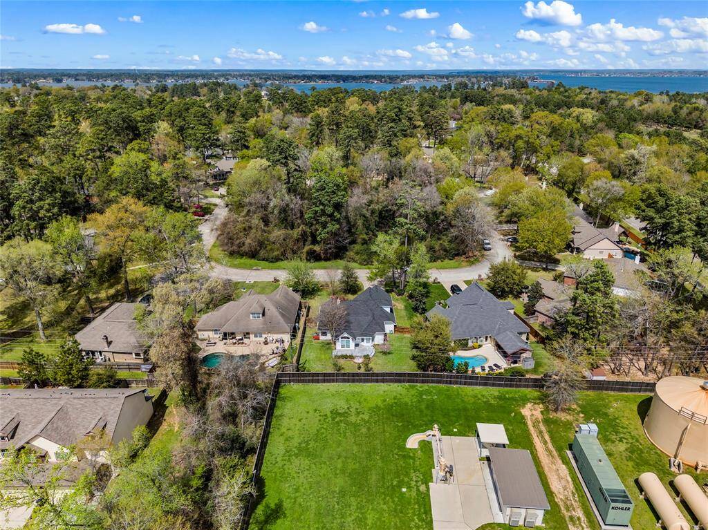 No back neighbors with an 8 ft privacy fence behind the property. 1 acre reserve shown across the street.