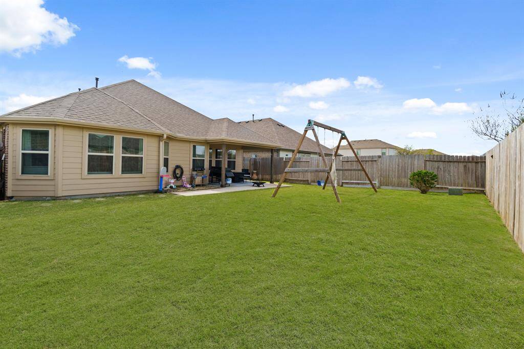 Fully fenced back and well manicured back yard.