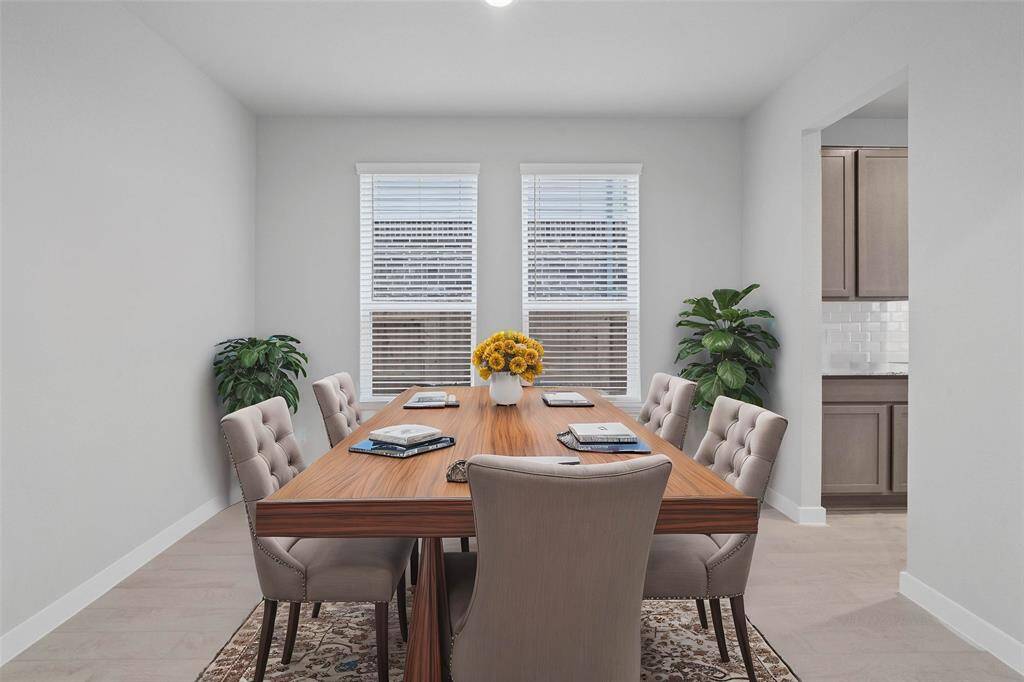 You and your guests will certainly dine in style in this amazing formal dining room! Featuring large windows with privacy blinds, neutral paint, high ceilings, recessed lighting, and tile flooring! Perfect space to entertain family and friends!