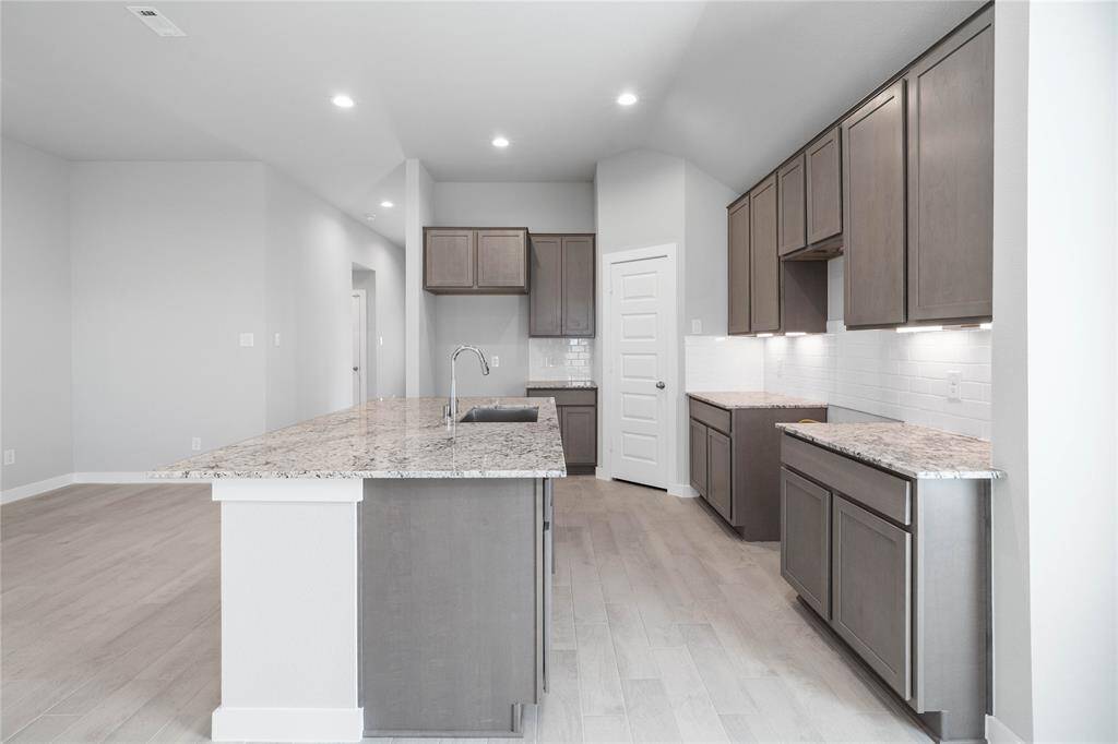 Another view of this spacious kitchen!