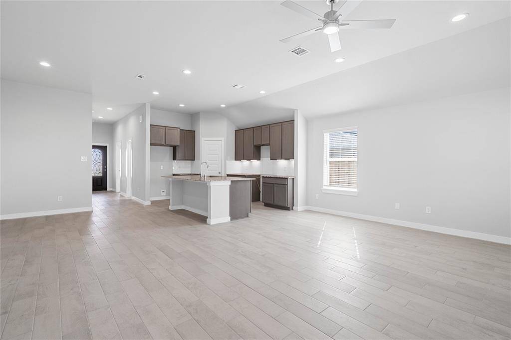 Another view taken from Family Room into the kitchen.