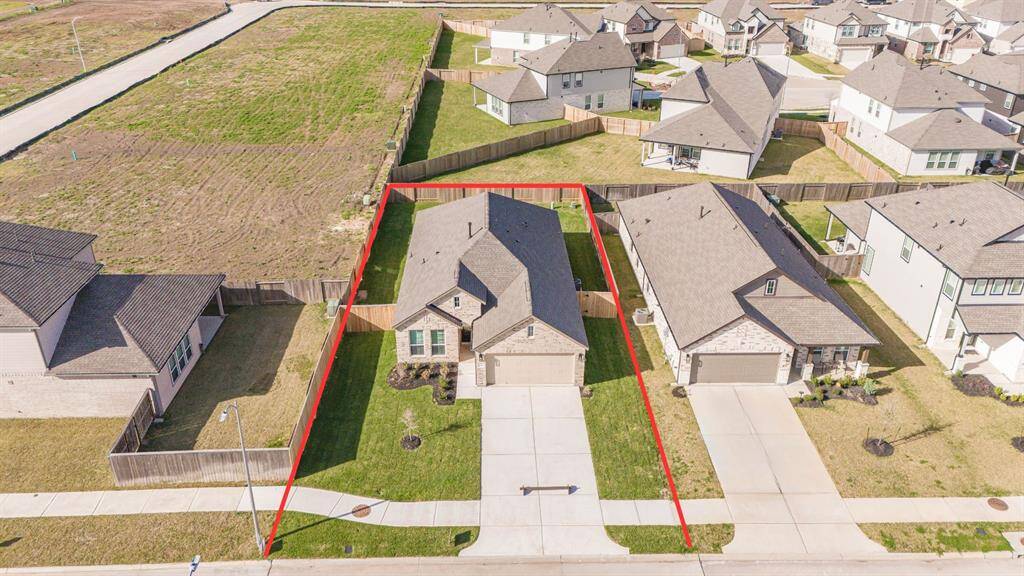 This home sits on a large lot with ample yard space in front and the back, lush landscaping and well-maintained yard!