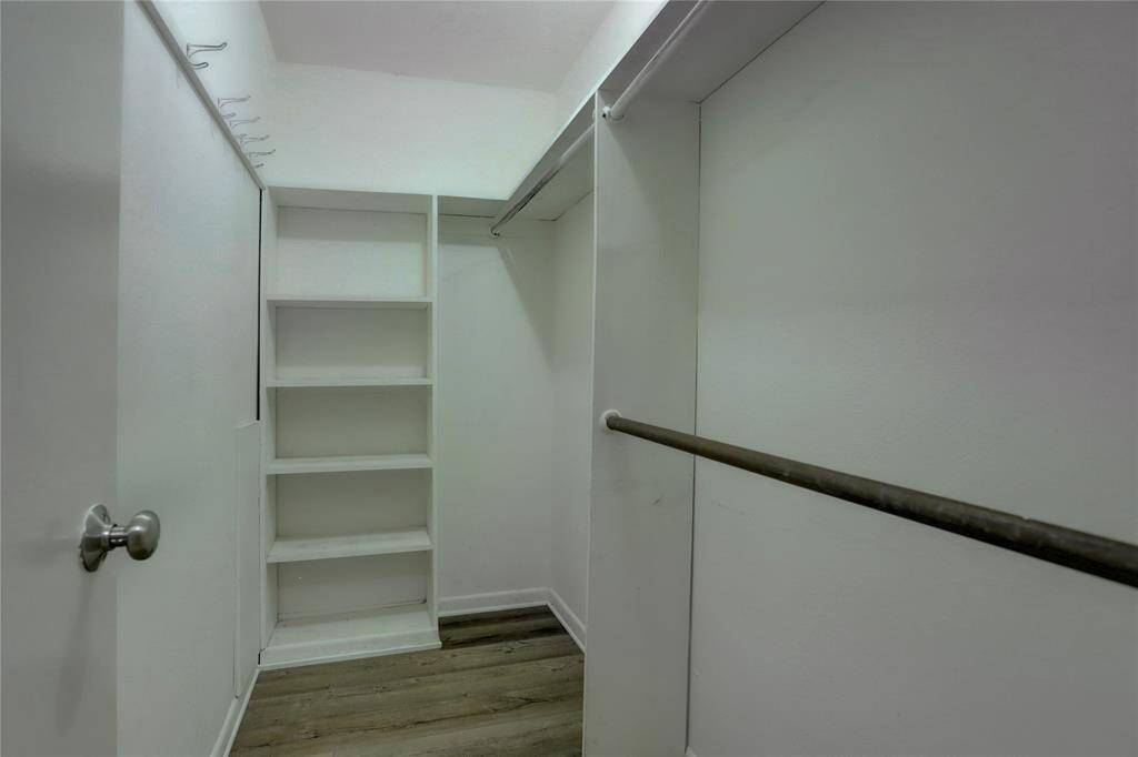 The primary bedroom boasts a spacious walk-in closet, perfect for storing all your belongings.