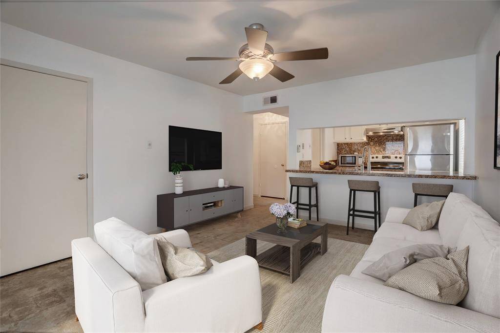 An alternative perspective of the living area shows a tranquil tone of hues and up-to-date finishes that serve as a stunning foundation for a selection of furniture and adornment choices. Digitally Staged