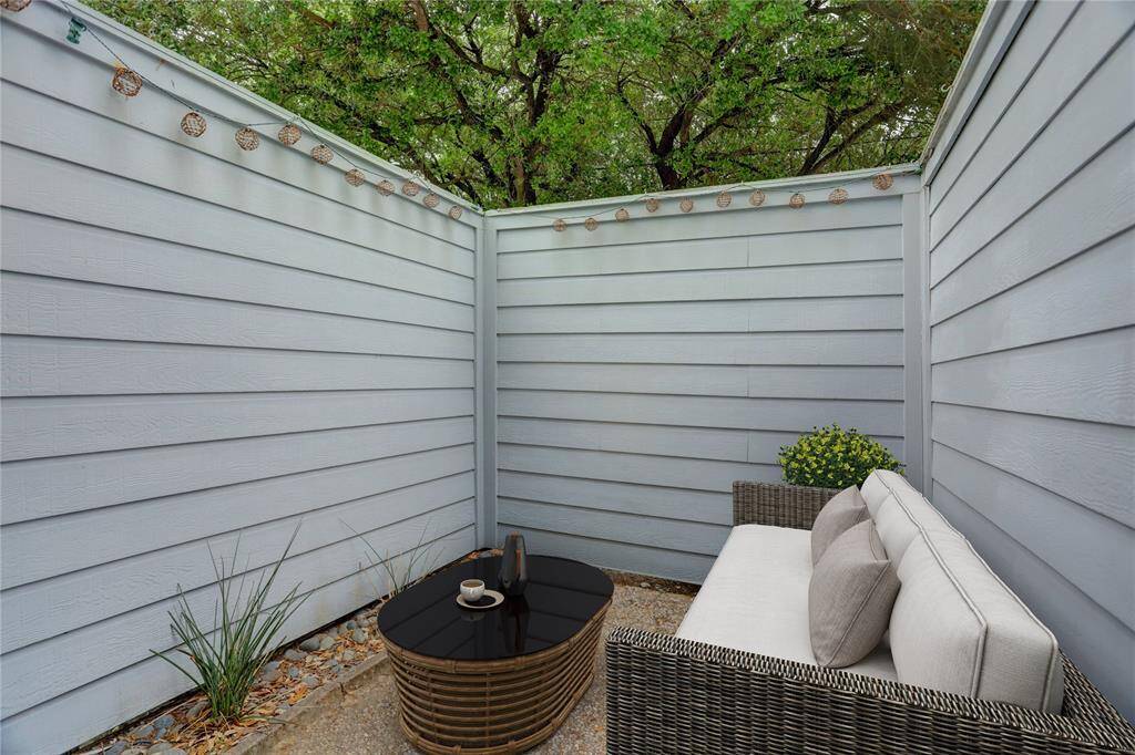 The back patio is spacious enough for a grill, and the glass doors that are larger in size allow for the maximum amount of natural light to penetrate the interior. Digitally Staged.