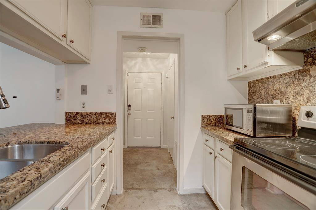 The kitchen is generously appointed with granite countertops and stainless steel appliances, making it a large and convenient space for dining, food preparation, and social gatherings.