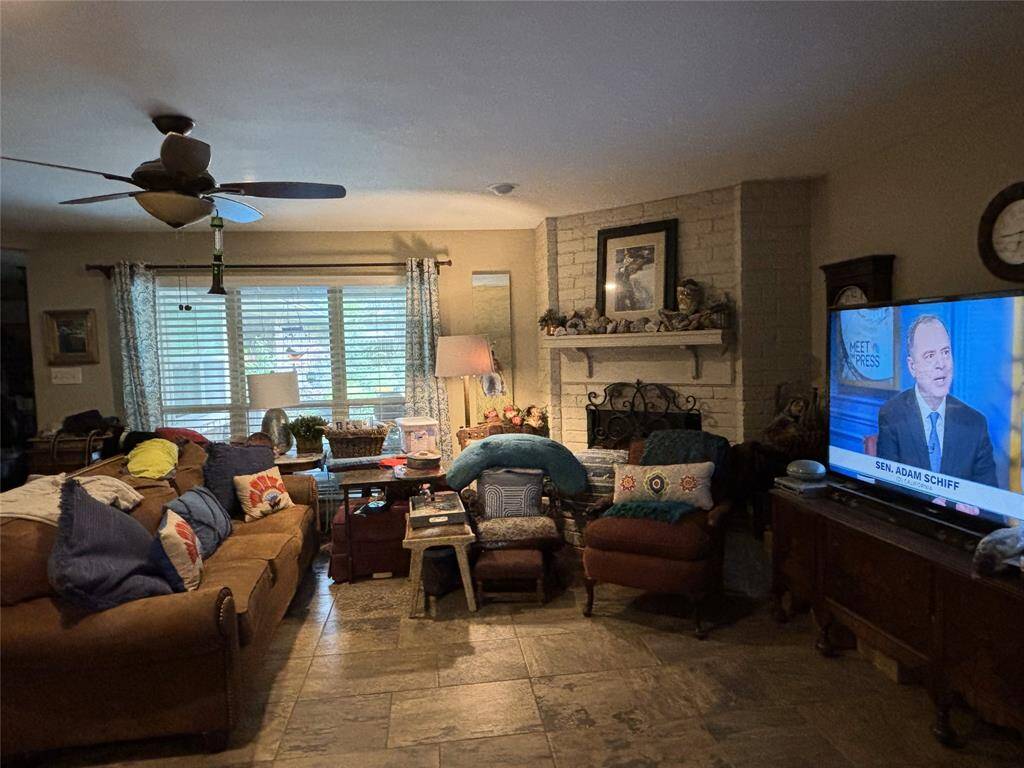 Living area with fireplace, and recessed lighting