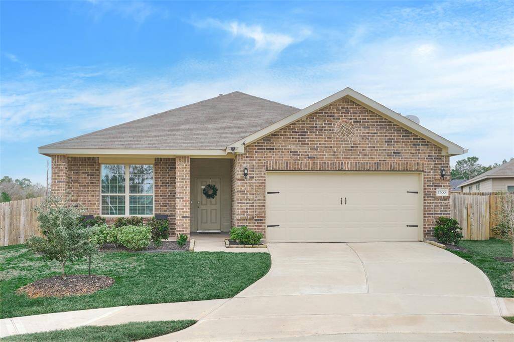 This charming single-story home features a classic brick exterior, a well-maintained front yard, and a two-car garage. The covered entryway adds a welcoming touch. Perfect for families seeking a cozy, inviting space.