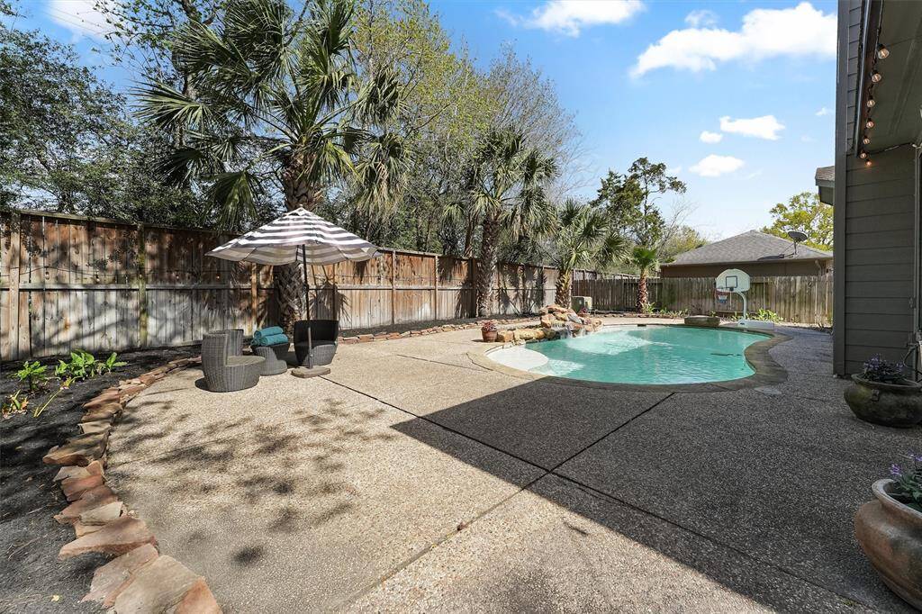 Spacious backyard area is great for entertaining complete with grassy side yard (not pictured) perfect for your pups.