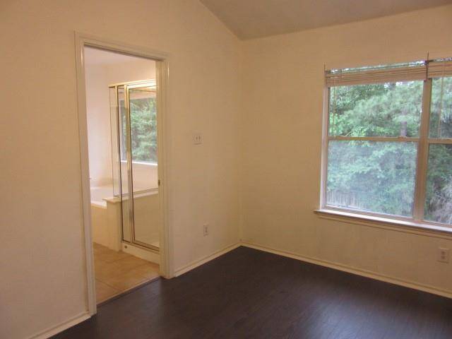 Primary bedroom overlooking the woods