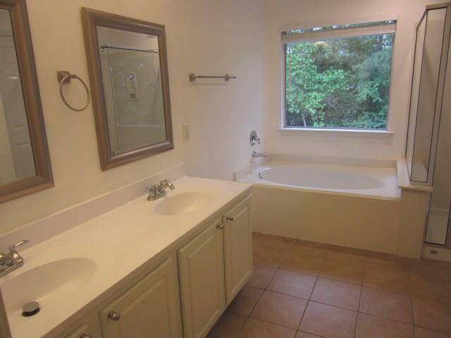 Spacious and light filled parimary bath with double vanities