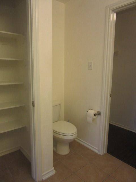 Linen closet and walk-in closet in primary bath
