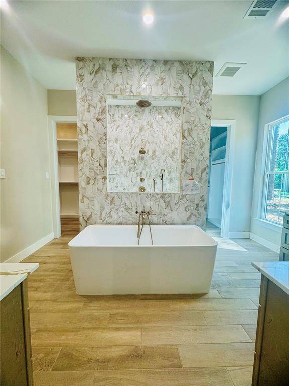 Beautiful floor to ceiling tile work throughout this magical en-suite