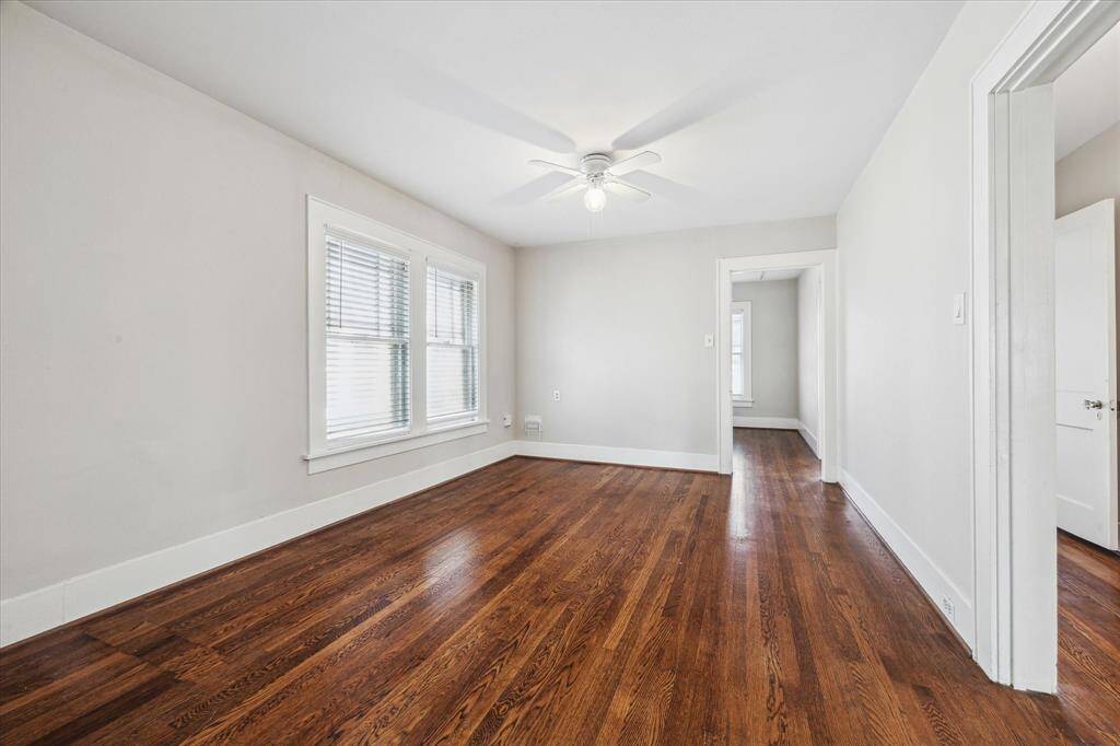 Living room with lovely hardwood floors and natural light.