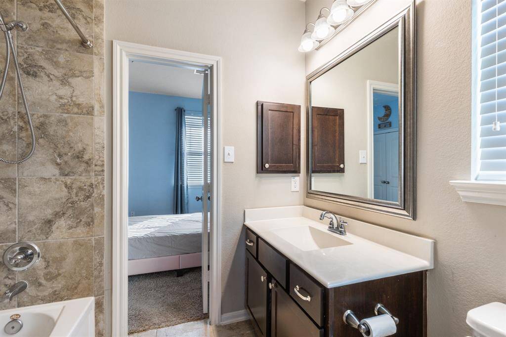 Two secondary bedrooms share a secondary bathroom.