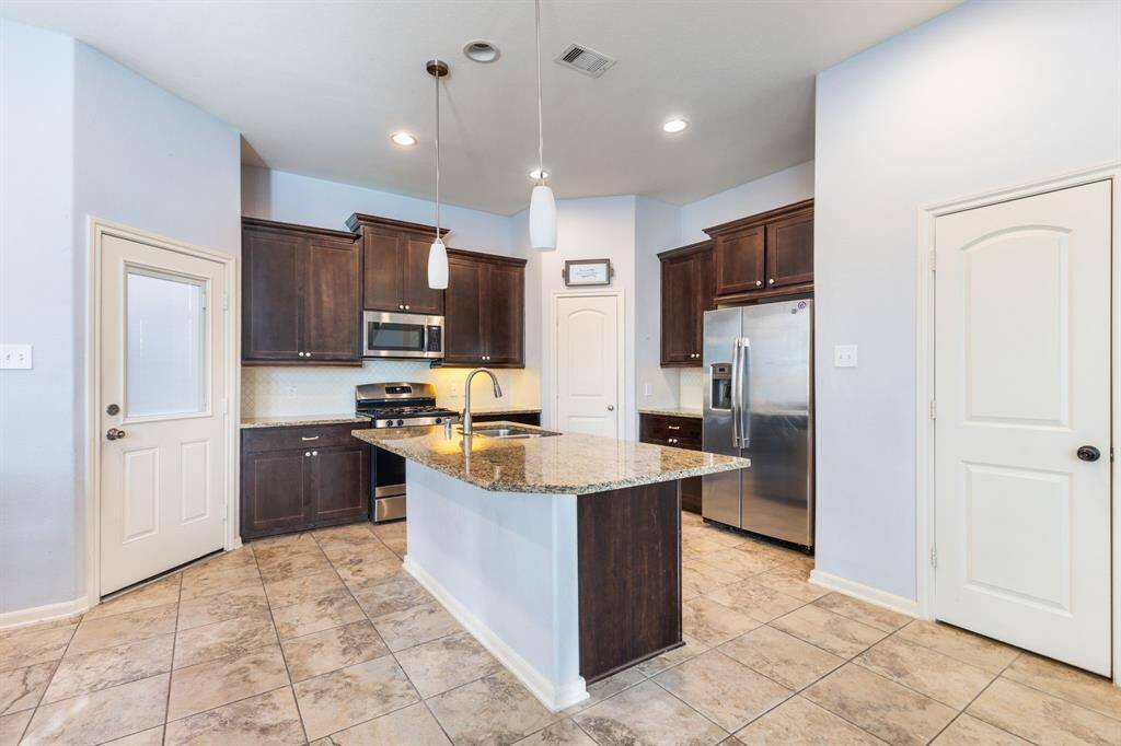 The kitchen island provides additional seating all around! Great for having meals on the go!