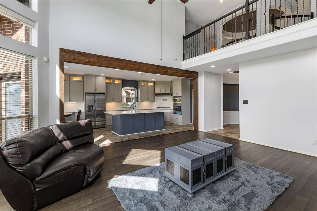 Notice the wooden beam detail framing the kitchen.