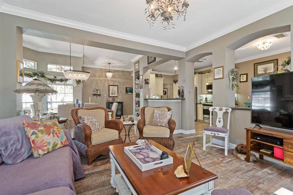 A view looking across the living room back into the dining room.