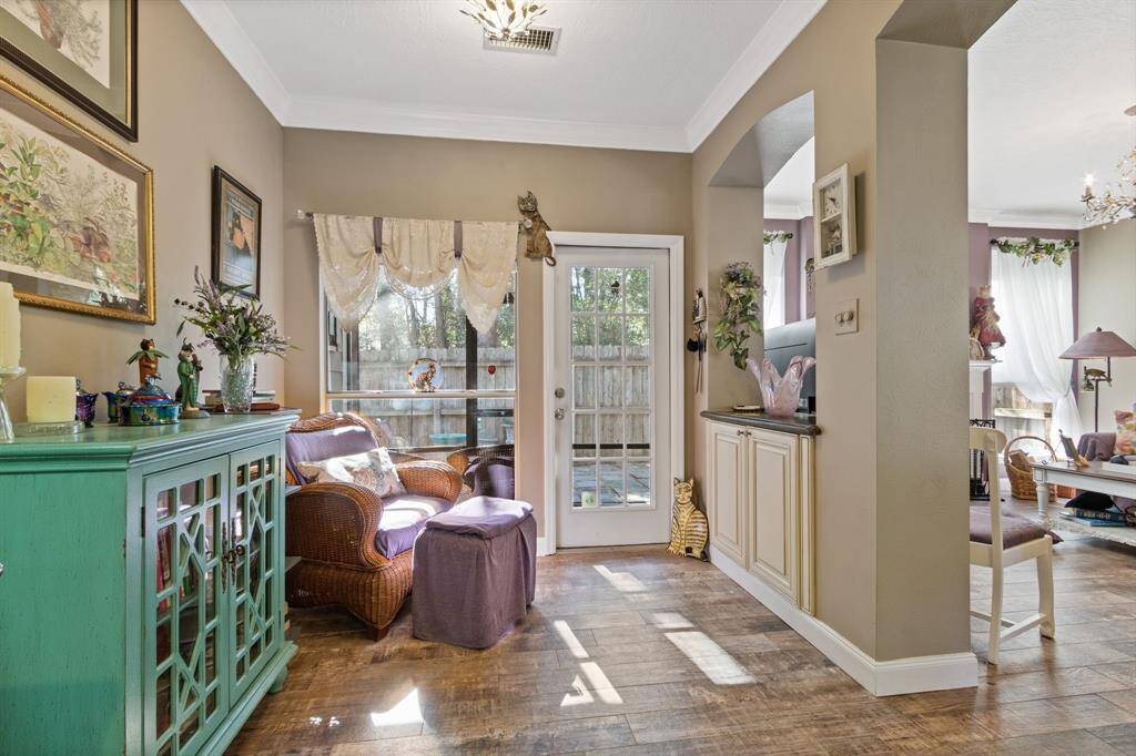 The light and bright breakfast area overlooks the back patio and is perfect for casual, everyday dining.  Note the extra counter space and cabinetry in lieu of a pony wall.