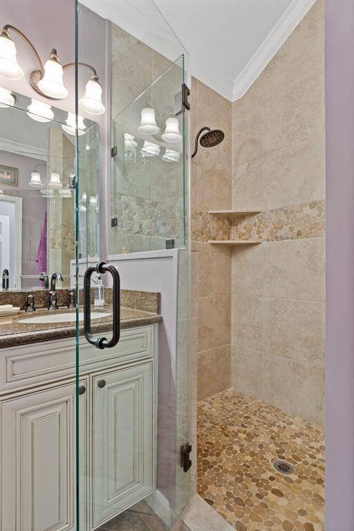 The primary bath also featutes a large fully tiled walk-in shower.