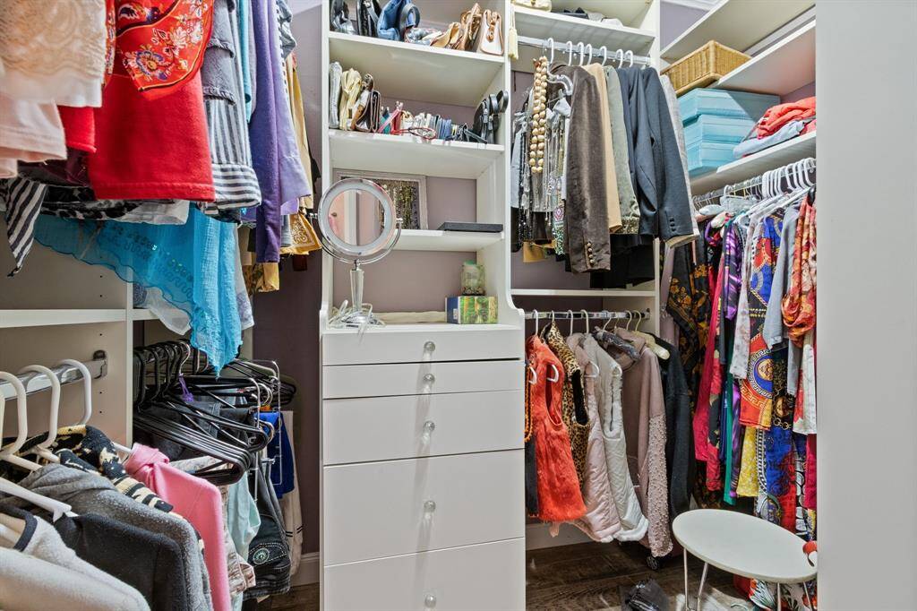 A closet organizer optimizes the functionality and storage space of the primary closet.