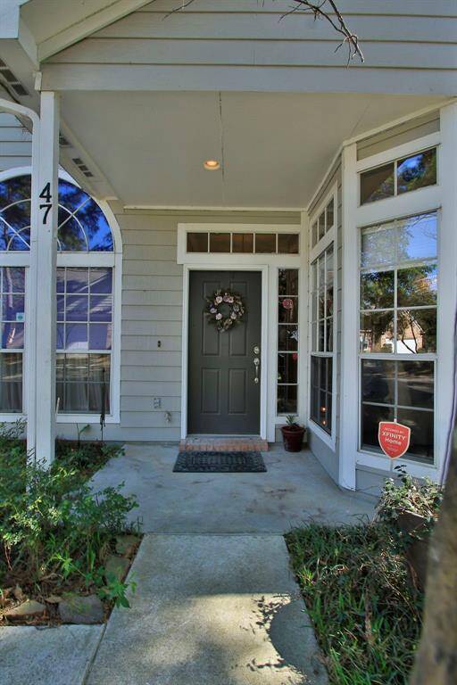 A large front porch protects guests and the main entry from the elements.