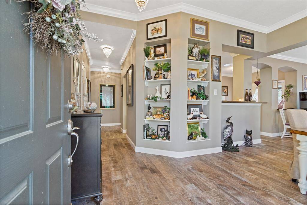 The beauty of this updated condominium is evident from the very moment you walk through the door!  Wood-like tile with no grout lines runs throughout the entire unit. The tile installation was done so well that you can't tell it's not real wood even upon closer inspection!  Tall, clean baseboards throughout also compliment the flooring.
