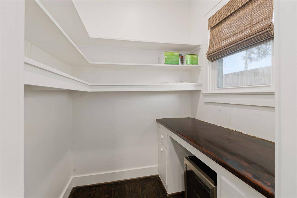 Walk in butlers pantry, features beverage cooler hidden at bottom.