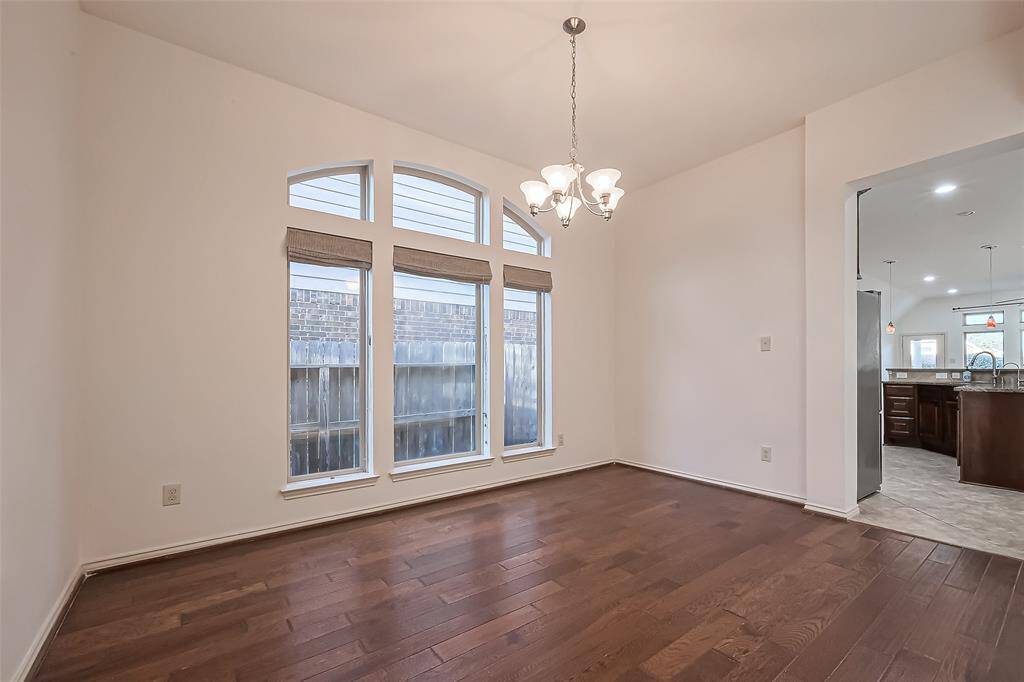 Formal Dining Room with a huge window, accessible to the kitchen.
