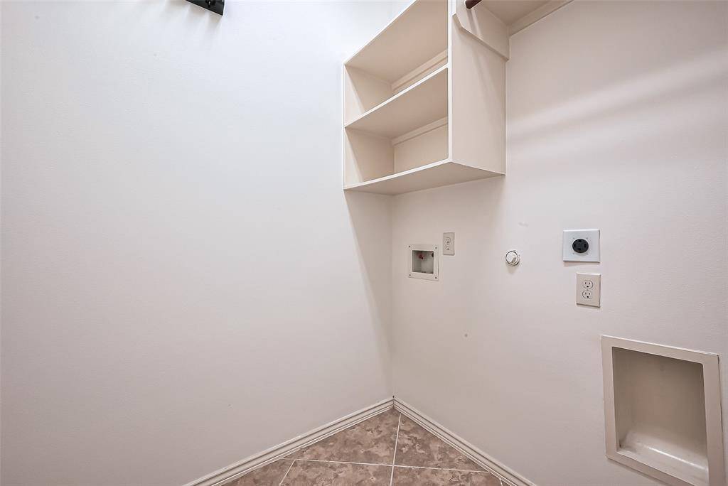 Laundry Room with built-in shelving.