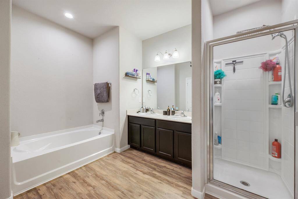 The primary bathroom has a nice tub with a separate shower.