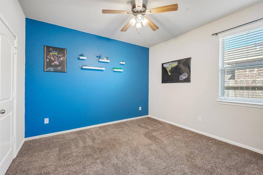 The middle secondary bedroom has a nice touch of color in it